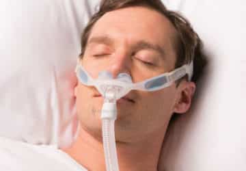 2-philips-respironics-nuance-pro-nasal-pillows-in-use-male.jpg